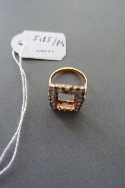 Gold ring setting paved with white and green...