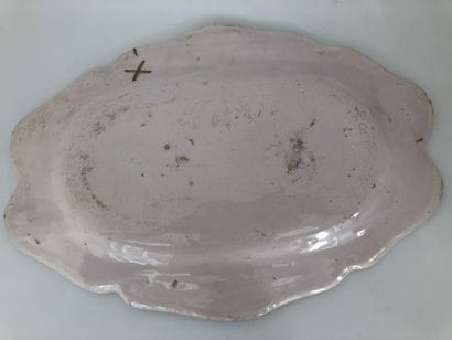 Three oval earthenware dishes with a contoured...