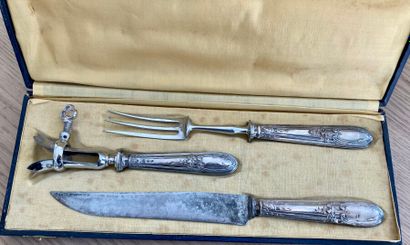 A case containing a carving set and a stuffed...