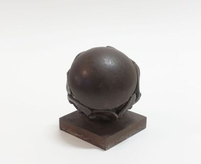 Wrought iron paperweight representing a stylized...