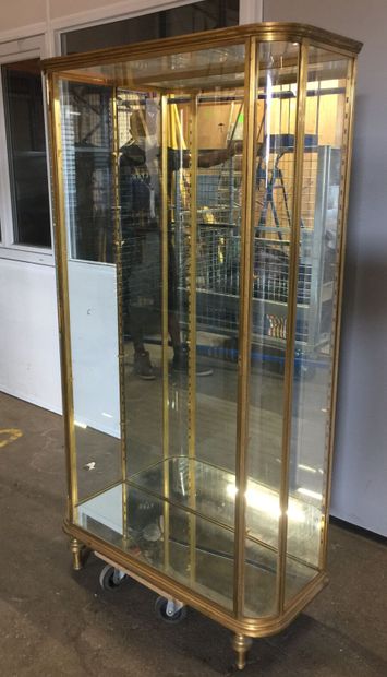 Gilded brass display case with shelves, rounded...
