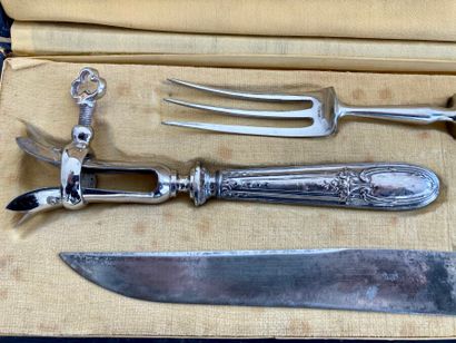 A case containing a carving set and a stuffed...