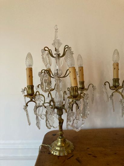 Pair of brass girandoles and four-light pendants.

Louis...