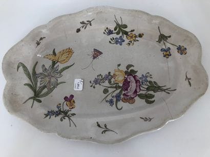 Three oval earthenware dishes with a contoured...