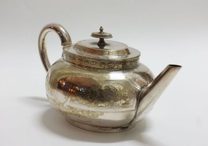 Oval teapot in silver plated metal with incised...
