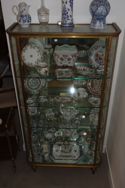 Gilded brass display case with shelves, rounded...