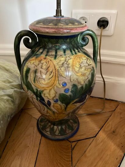 Ceramic vase mounted as a lamp with vegetal...