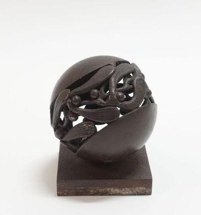 Wrought iron paperweight representing a stylized...