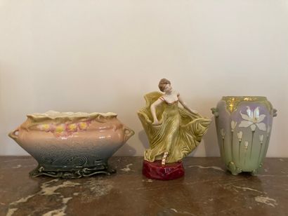 Two vases and a polychrome ceramic subject.

Art...