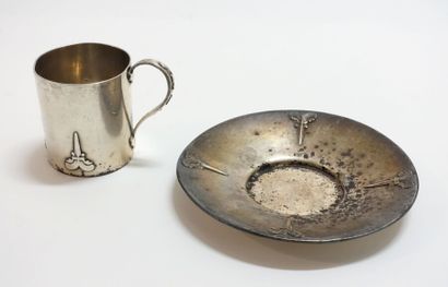 Silver cup and saucer with Celtic sword motifs....