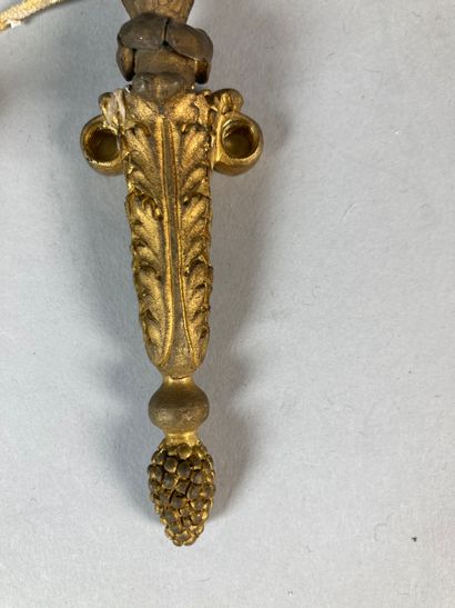 Pair of thin gilt bronze sconces with a light...