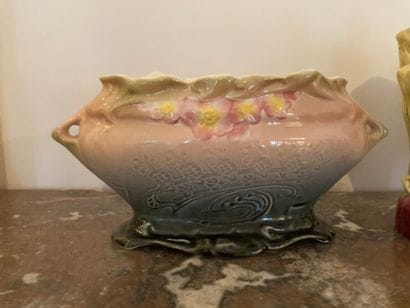 Two vases and a polychrome ceramic subject.

Art...