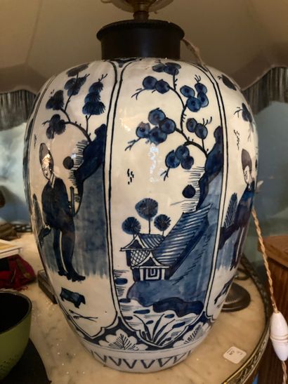 Meeting of two earthenware vases with blue-white...