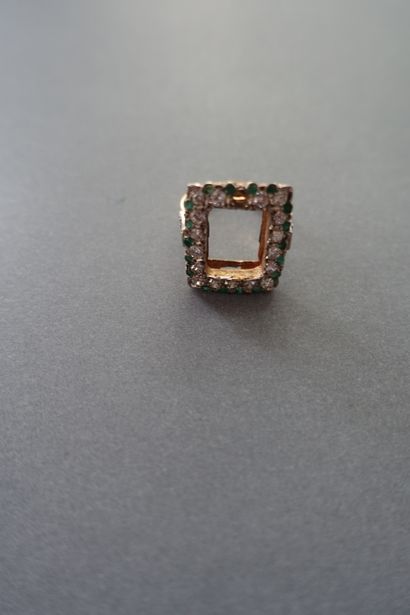 Gold ring setting paved with white and green...