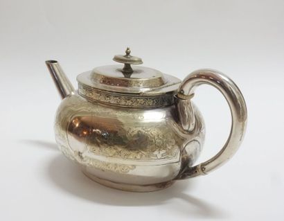 Oval teapot in silver plated metal with incised...