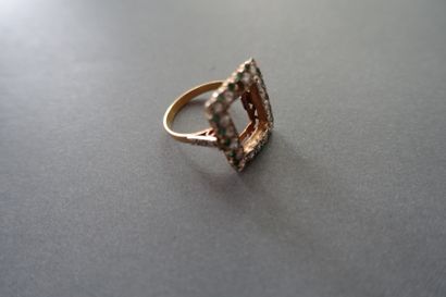 Gold ring setting paved with white and green...