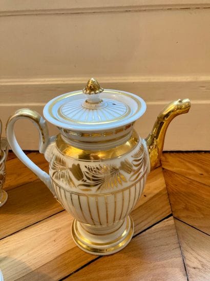 White and gold porcelain service including...
