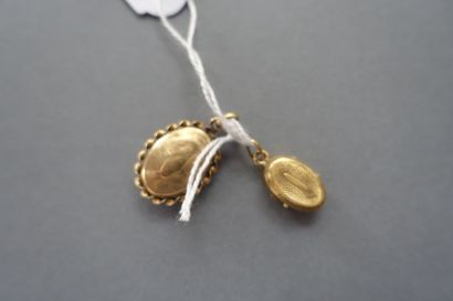 Two 750 thousandths gold medallion pendants.

Gross...