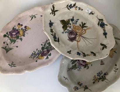 Three oval earthenware dishes with a contoured...