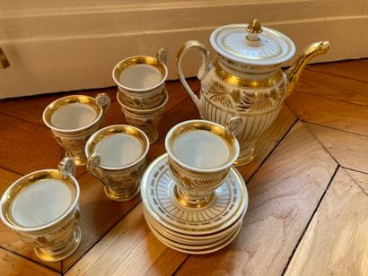White and gold porcelain service including...