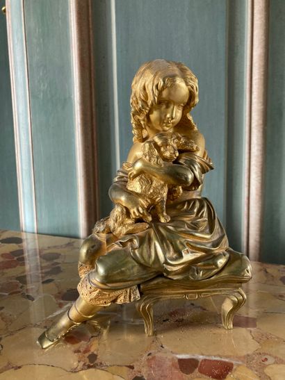 Girl and her dog in gilt bronze. 

19th century....