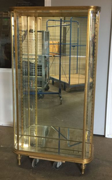 Gilded brass display case with shelves, rounded...