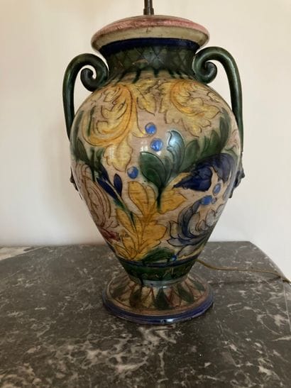 Ceramic vase mounted as a lamp with vegetal...