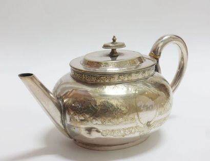 Oval teapot in silver plated metal with incised...