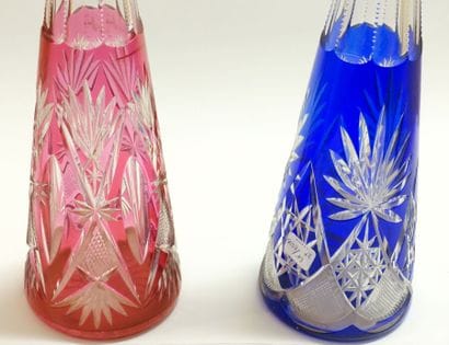 Pair of large carafes and their stoppers,...