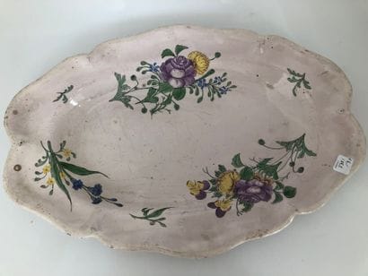 Three oval earthenware dishes with a contoured...