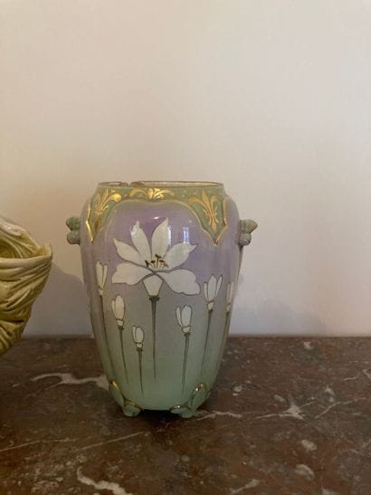Two vases and a polychrome ceramic subject.

Art...