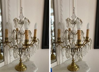 Pair of brass girandoles and four-light pendants.

Louis...
