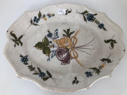 Three oval earthenware dishes with a contoured...