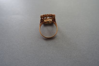 Gold ring setting paved with white and green...