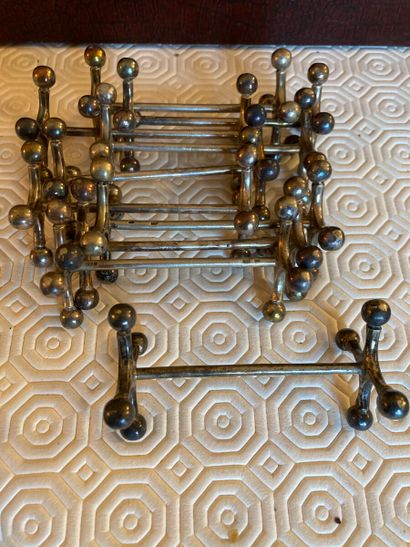 Ten silver plated metal knife holders, cross...