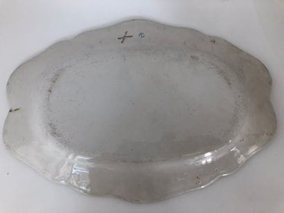 Three oval earthenware dishes with a contoured...