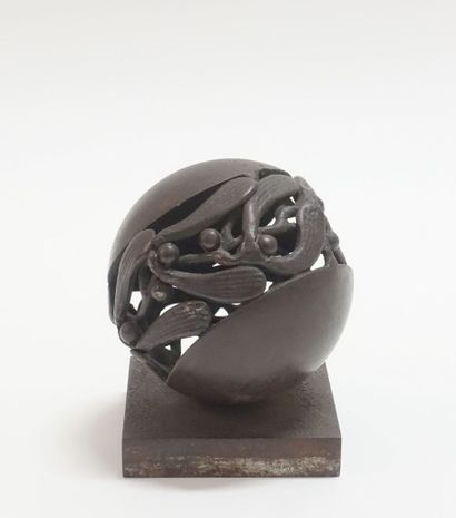 Wrought iron paperweight representing a stylized...
