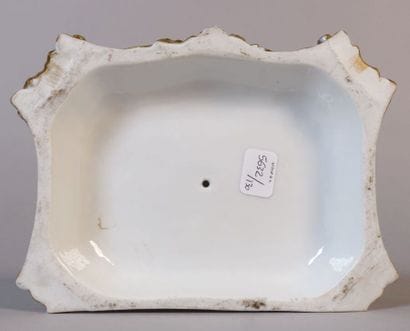 Polychrome porcelain group showing two young...