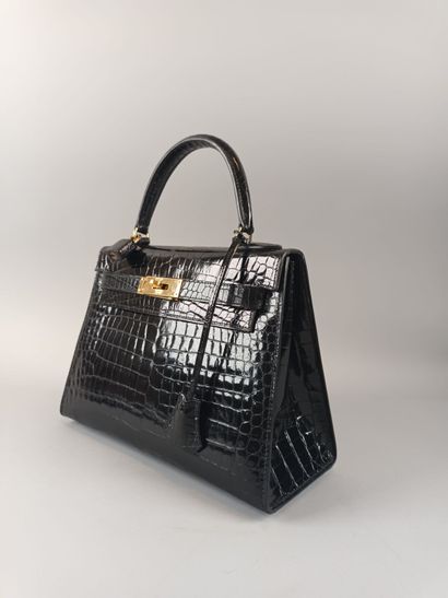 HERMÈS Paris
Mini Kelly 25 en crocodile noir,...