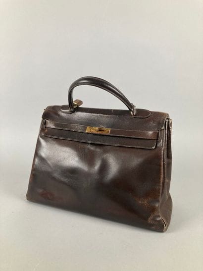 HERMÈS Paris
Sac Kelly 35 en box chocolat,...