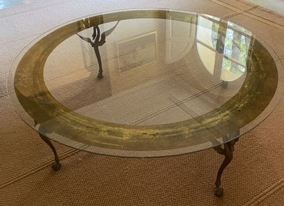 Table basse circulaire, le plateau en verre...
