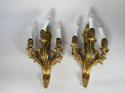Pair of three-light gilt bronze sconces with...