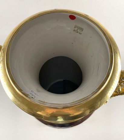 PARIS 
Large ovoid porcelain vase resting...