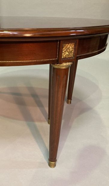 Mahogany dining room table of circular form,...