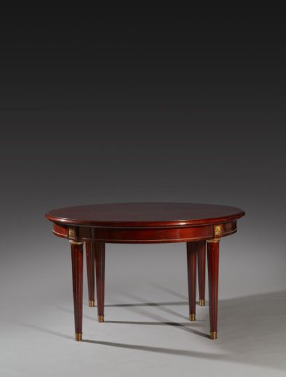 Mahogany dining room table of circular form,...