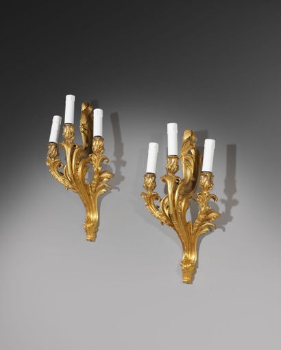Pair of three-light gilt bronze sconces with...