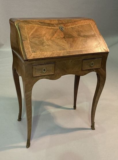 Walnut veneered sloping desk opening with...
