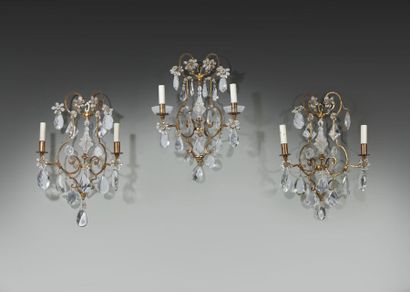 Suite of three sconces with two metal arms...