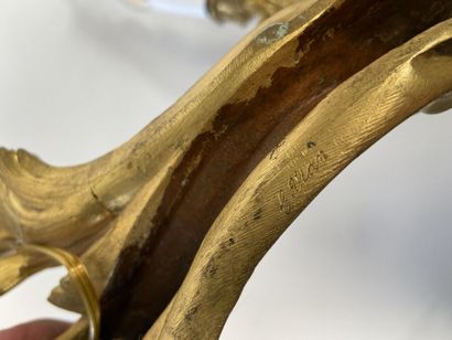 Pair of three-light gilt bronze sconces with...
