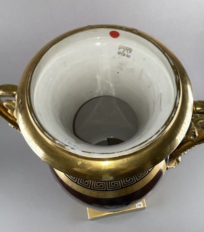 PARIS 
Large ovoid porcelain vase resting...